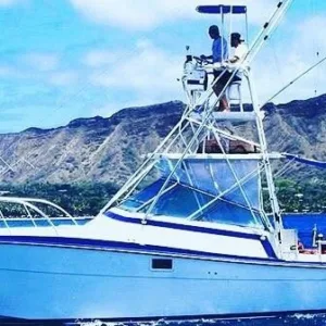 Boat cruising between islands on a clear day