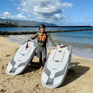 Student learning to ride efoil board on North Shore waters