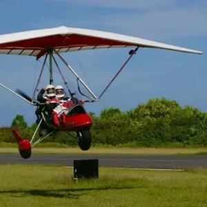 Thrilling powered hang gliding experience over tropical landscapes