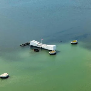 Helicopter flying over Pearl Harbor and Oahu sights