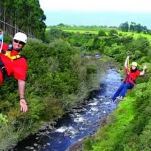 Participants enjoying thrilling 9-line zipline on Big Island