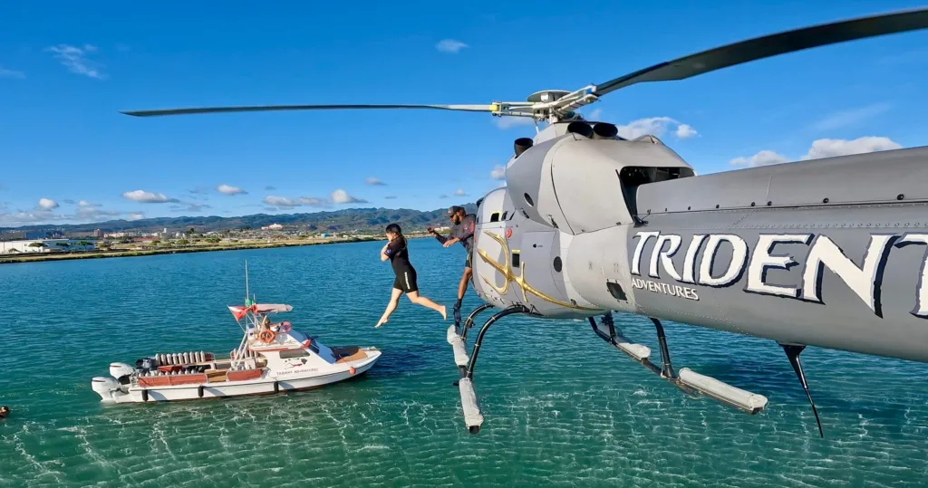 Helicopter flying over scenic Hawaiian landscapes during tour