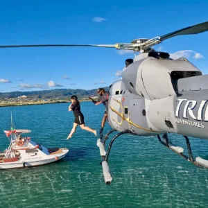 Helicopter flying over scenic Hawaiian landscapes during tour