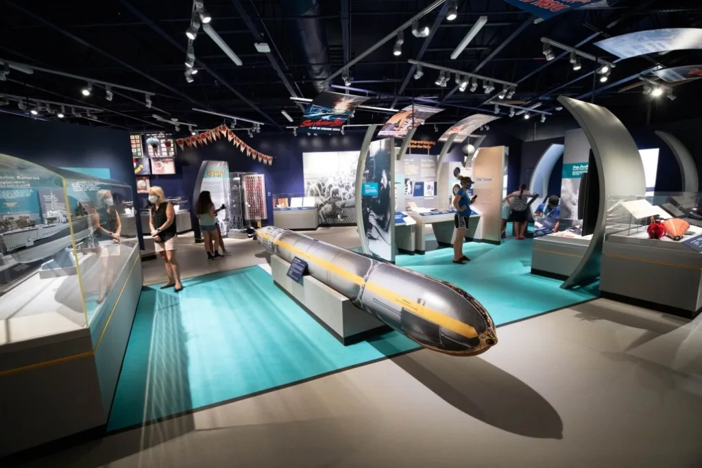 Tour group visiting Arizona Memorial at Pearl Harbor site