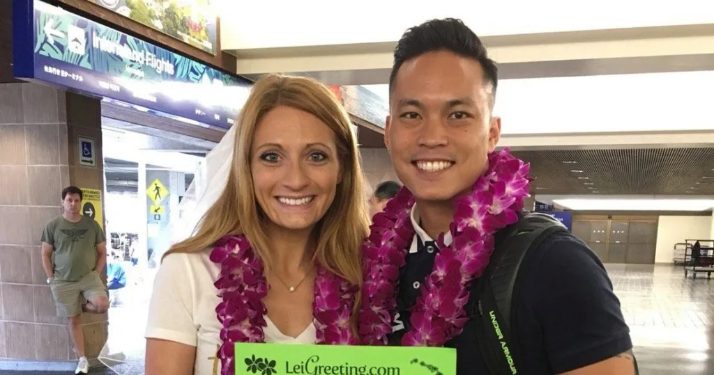 Hawaii honeymooners receiving leis at Kona Airport arrival area