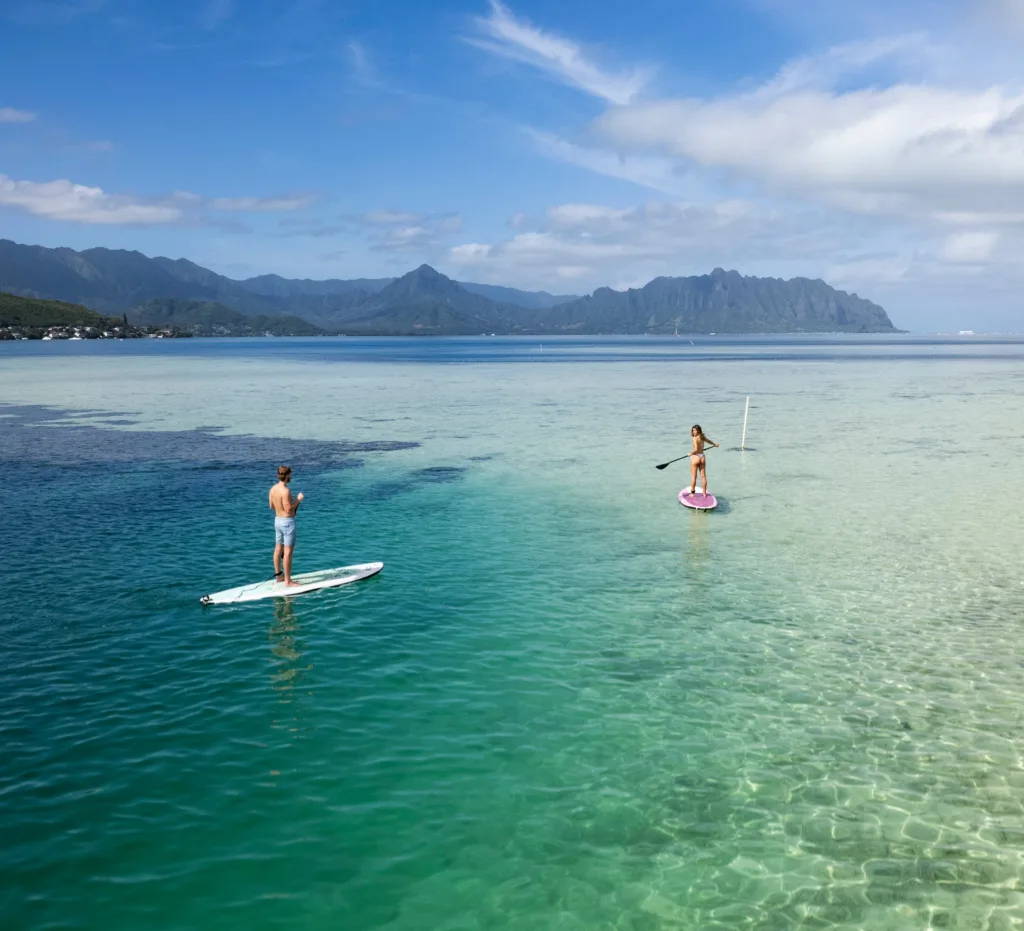 Adventurers snorkeling and splashing around Kaneohe sandbar