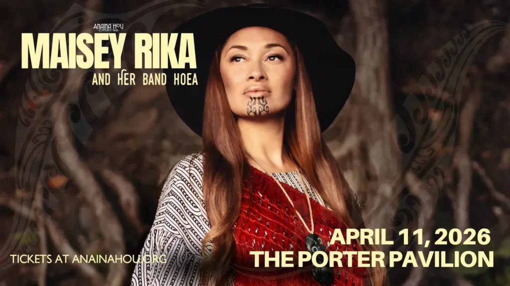 Maisey Rika performing live on stage with passion