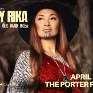 Maisey Rika performing live on stage with passion