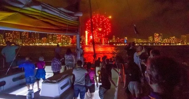 Evening cruise watching vibrant fireworks over water