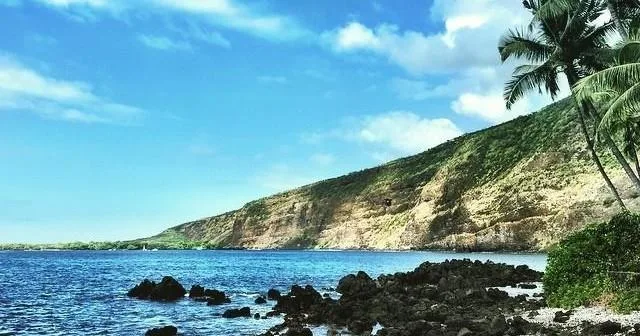 Kayakers paddling through clear waters of Kealakekua Bay