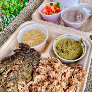 Chef preparing traditional Hawaiian dishes in cooking class