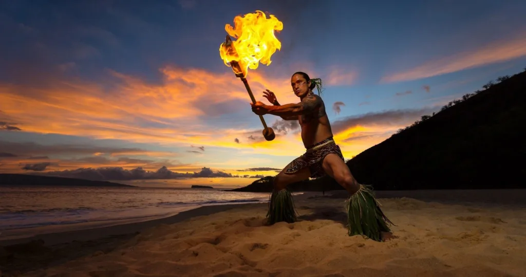 Guests enjoying Hawaiian luau feast outdoors