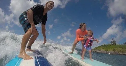 Instructor giving private surf lessons in Maui waters