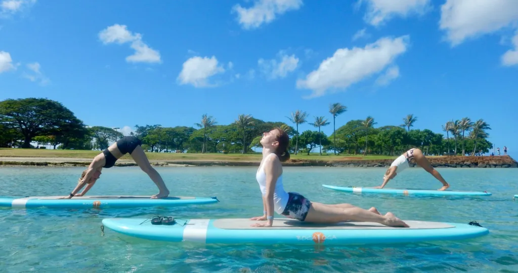 Instructor teaching stand up paddleboard techniques