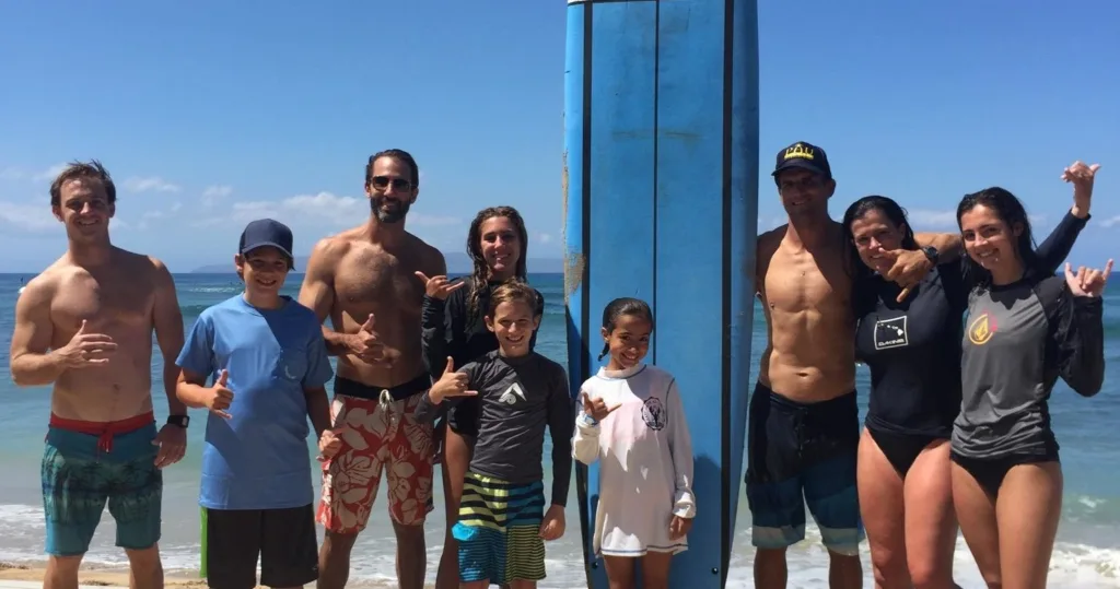 Group enjoying private surf lessons on Maui beach