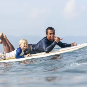 Instructor giving one-on-one private surf lesson