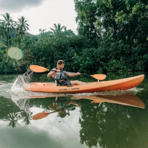Self-guided kayak tour through lush Hawaiian rainforest waterways