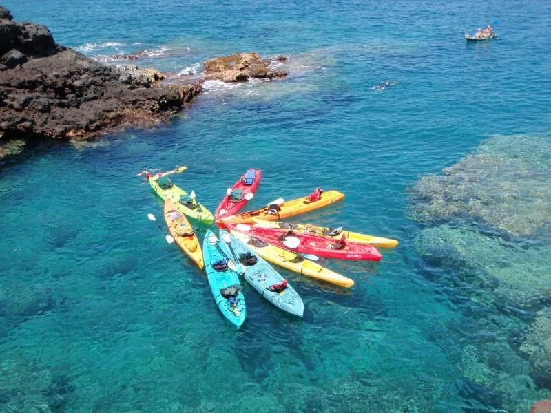 Exploring the sea cave by kayak at Keahou Bay