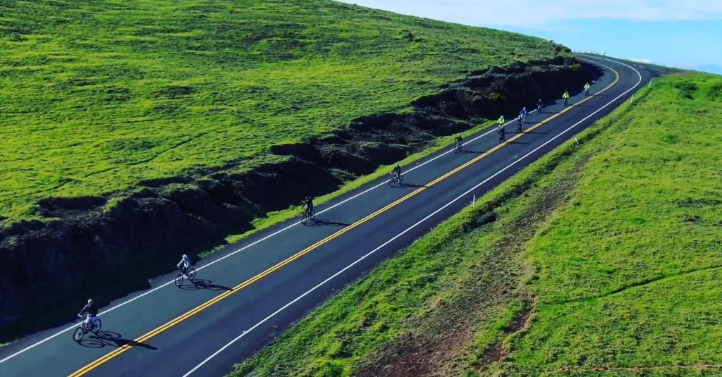 Cyclists riding along coastal path during Cycle to the Sea tour