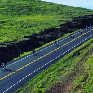 Cyclists riding along coastal path during Cycle to the Sea tour