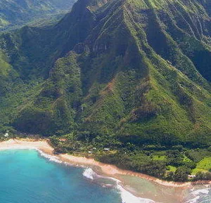 Small airplane flying over island landscapes during a custom air tour