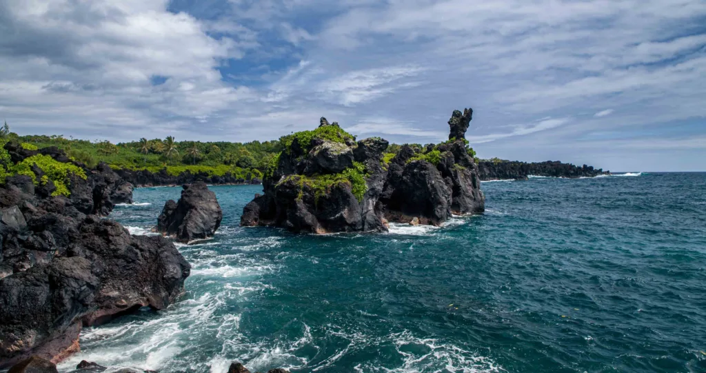 Lush Hana road winding through tropical Hawaiian landscape