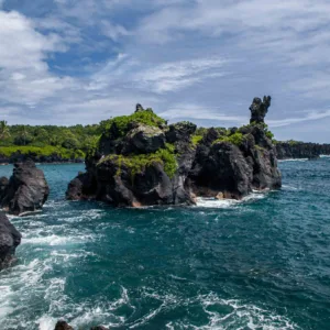 Lush Hana road winding through tropical Hawaiian landscape