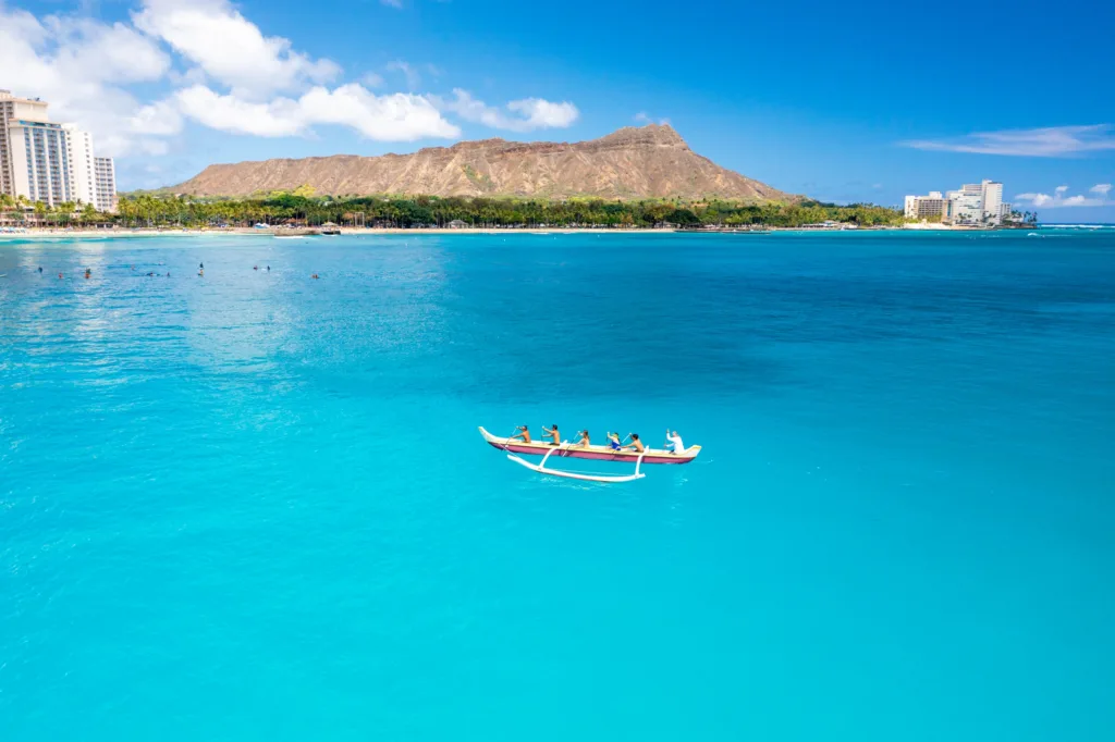 Canoe charter exploring tranquil island waterways and coastline