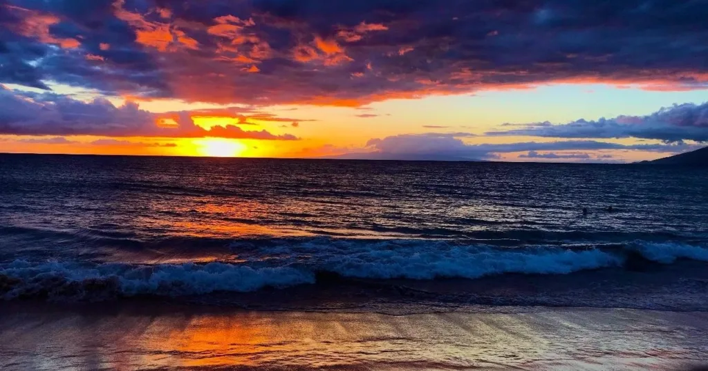Divers preparing for dusk and night dive with tanks ready