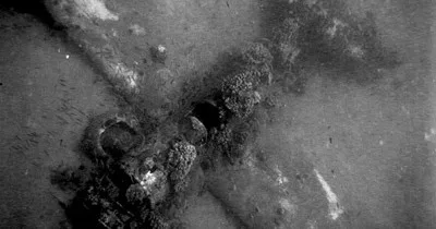 Diver exploring underwater wrecks at Helldiver and Triple Anchors