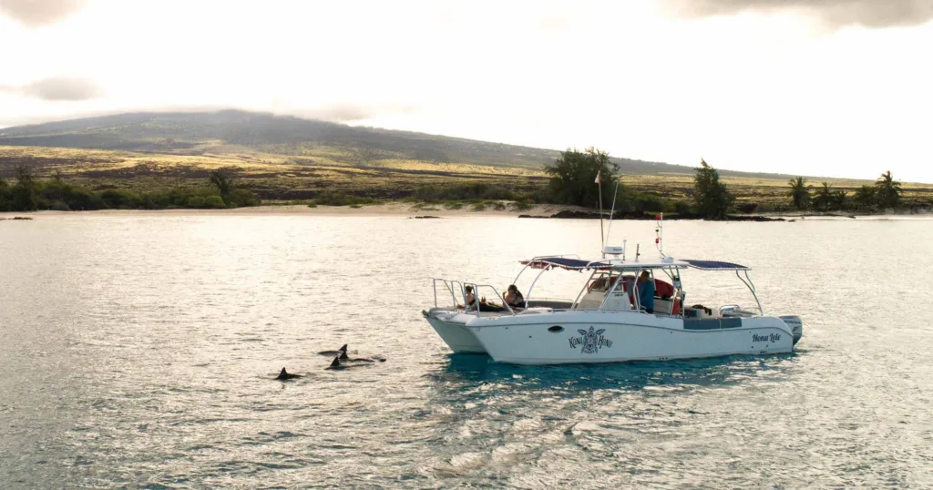 Private charter boat Honu Lele cruising clear blue waters