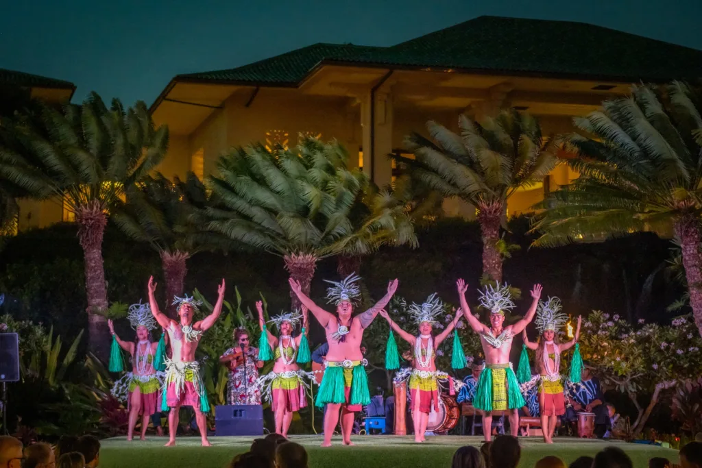 Guests enjoying general admission at Hawaiian luau with traditional dance