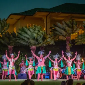 Guests enjoying general admission at Hawaiian luau with traditional dance