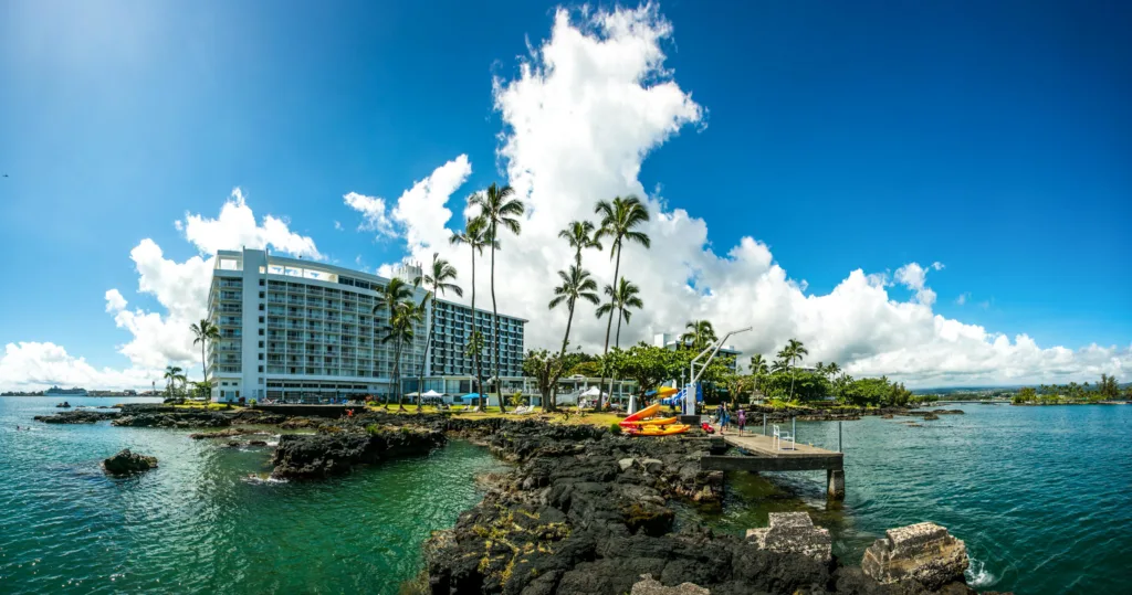Kayakers exploring historic Hilo Bay and nearby waterfalls