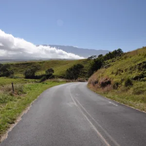 Cyclists riding along Sugar Cane Road near volcano