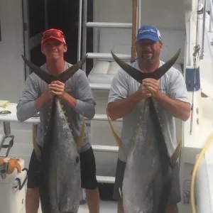 Fishermen preparing gear on boat for extended trip