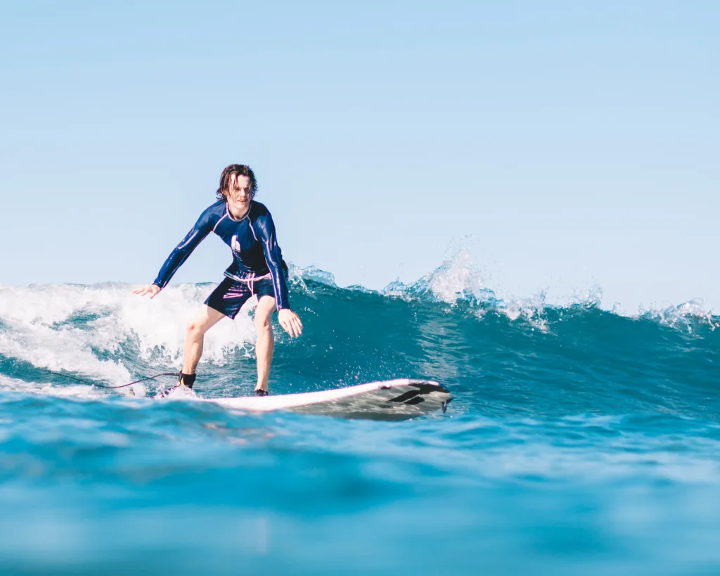 Beginner surf lessons on gentle island waves