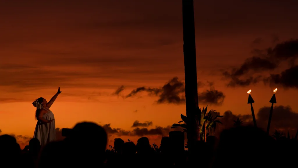Oceanfront luau stage with Polynesian dancers performing