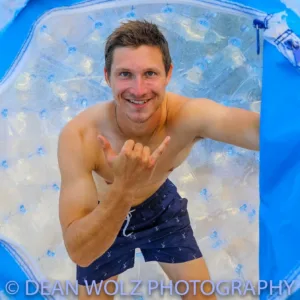 Person inside a giant inflatable aquaball on water