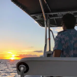 Sunrise cruise boat sailing along Hawaii’s coastline