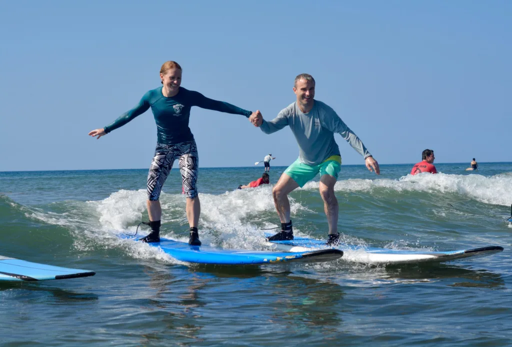 Surf instructor teaching basics on the beach