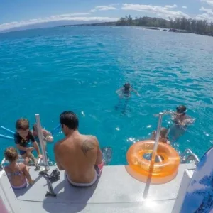 Private boat cruising near tropical Hawaiian coastline