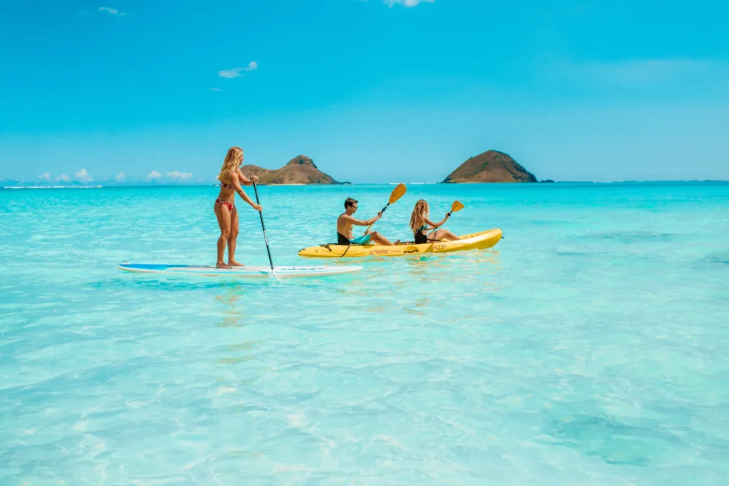 Kayaks lined up on a sandy Kailua Beach shore