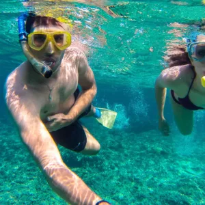 Beach gear including surfboards and chairs for rent