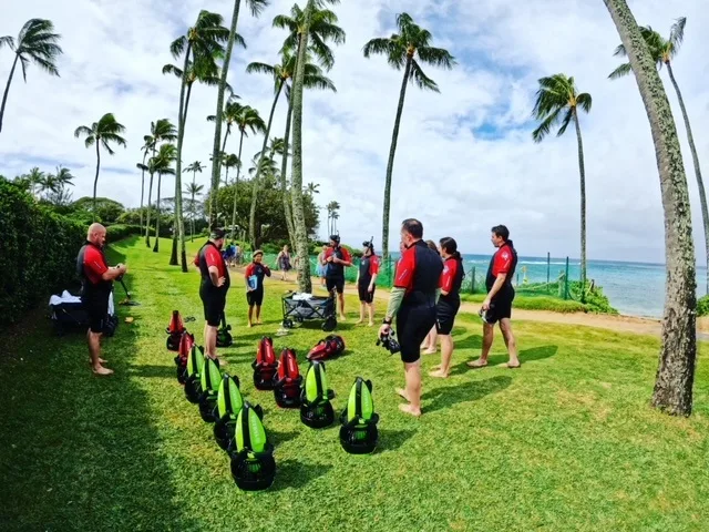 Two people riding Yamaha sea scooters in clear ocean water