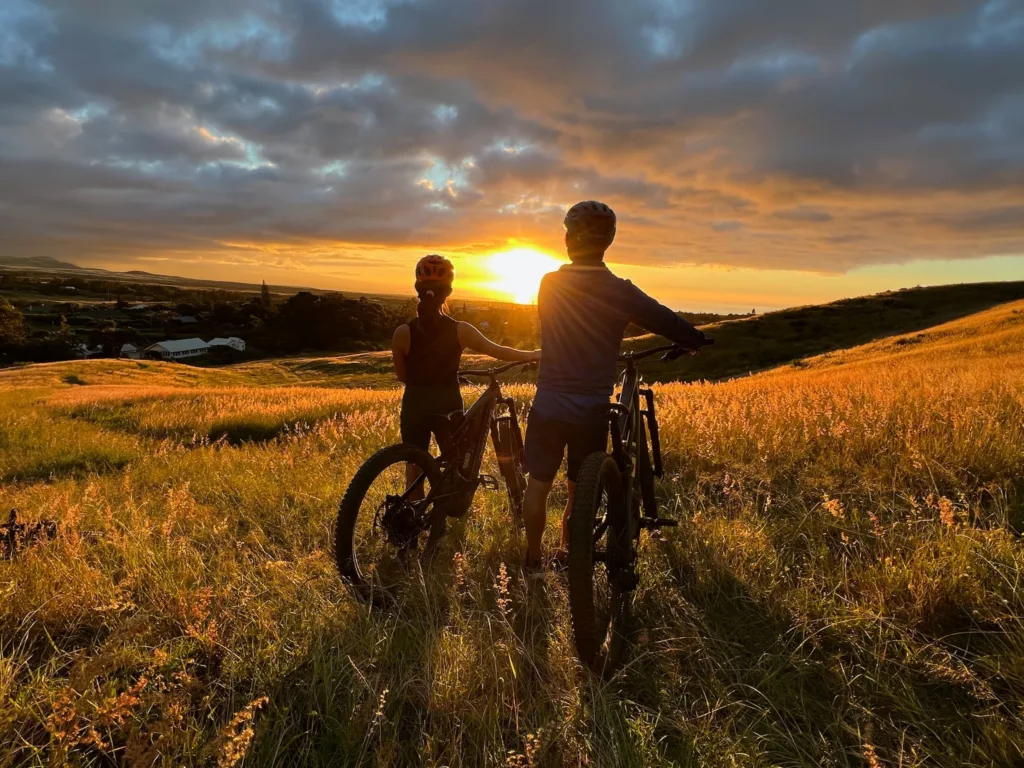 Cyclists riding along a scenic ranch trail