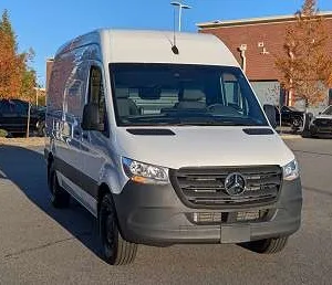 Shuttle van parked outside airport terminal