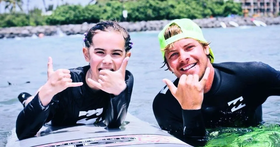 Private surf lesson with instructor guiding student