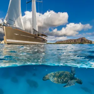 Luxury yacht sailing near Waikiki Beach coastline