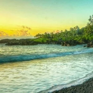 Tour vehicle driving along winding Road to Hāna